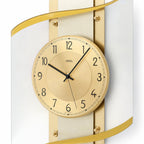 Standuhren.com 🕰️ AMS Funkwanduhr mit goldenem Zifferblatt, Messing-Akzenten und elegantem Design hinter Mineralglas